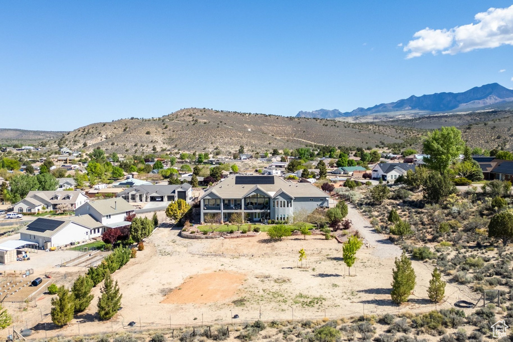 Aerial view of residential area featuring mountains