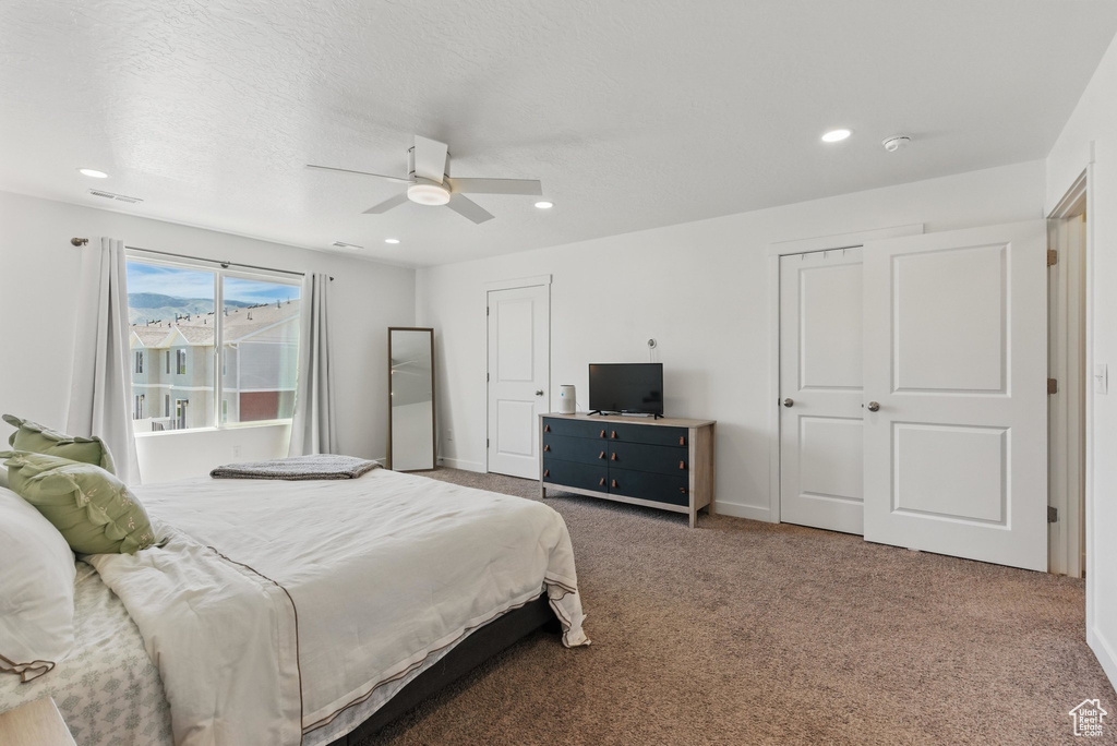 Bedroom featuring carpet flooring, a ceiling fan, recessed lighting, and baseboards