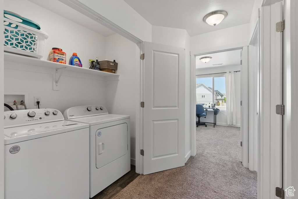 Laundry room with independent washer and dryer and carpet floors
