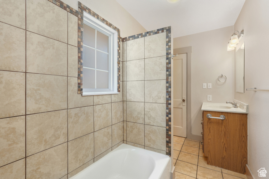 Bathroom featuring tile patterned floors and vanity