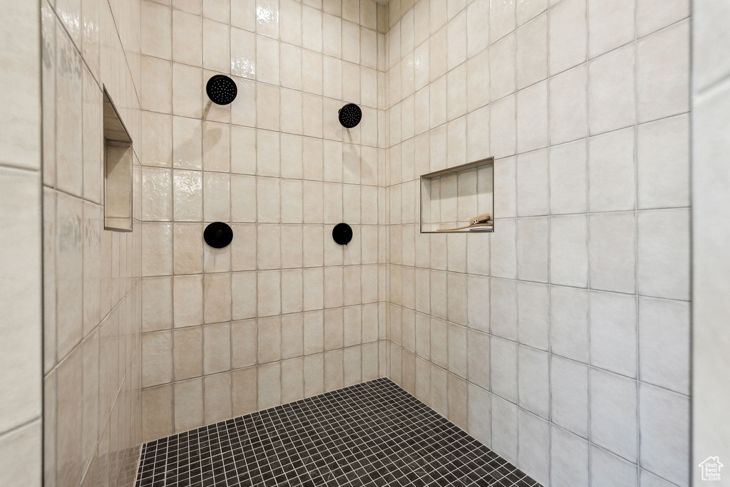 Full bathroom featuring tiled shower