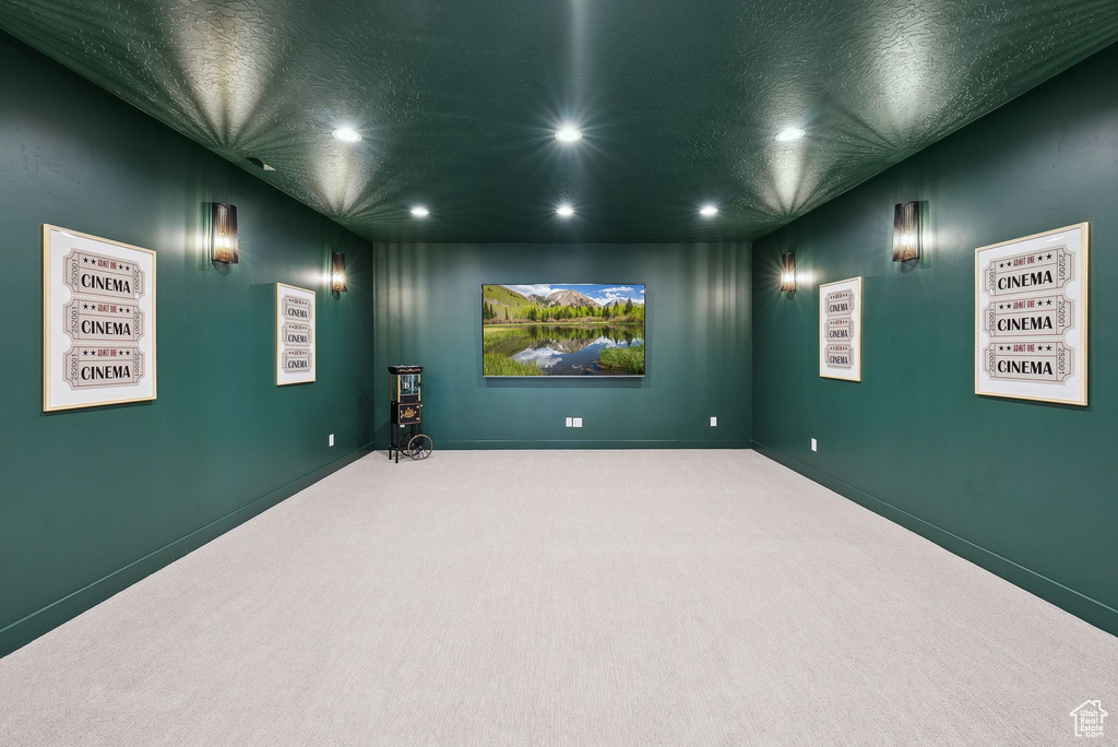 Cinema with recessed lighting, carpet flooring, a textured ceiling, and baseboards