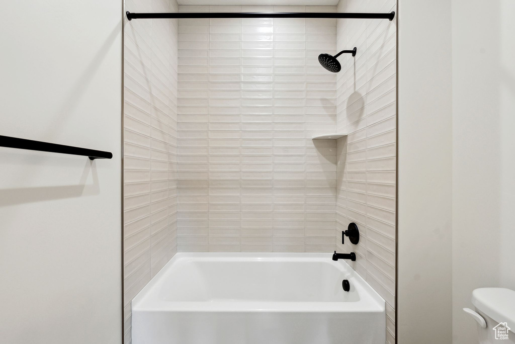 Full bath with toilet and shower / tub combination