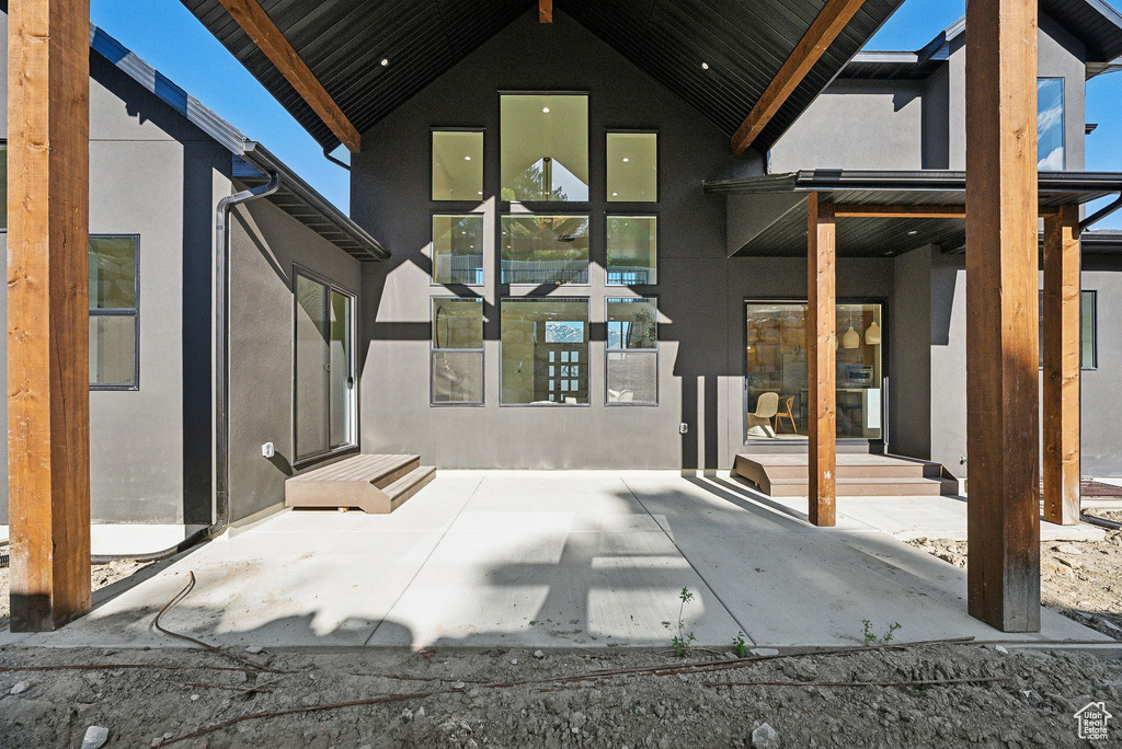 Rear view of property featuring stucco siding
