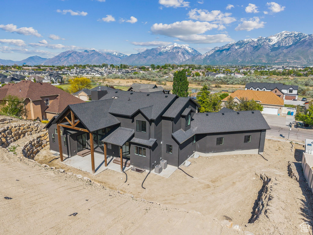 Aerial perspective of suburban area with a mountain backdrop