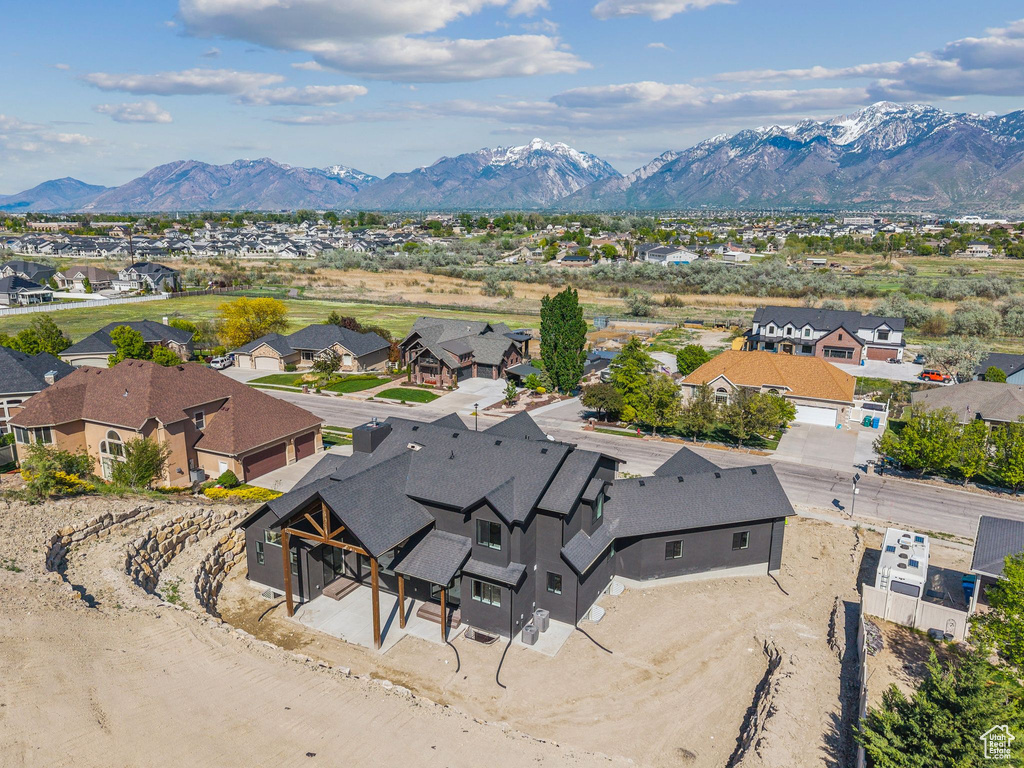 Aerial view of residential area featuring a mountain backdrop