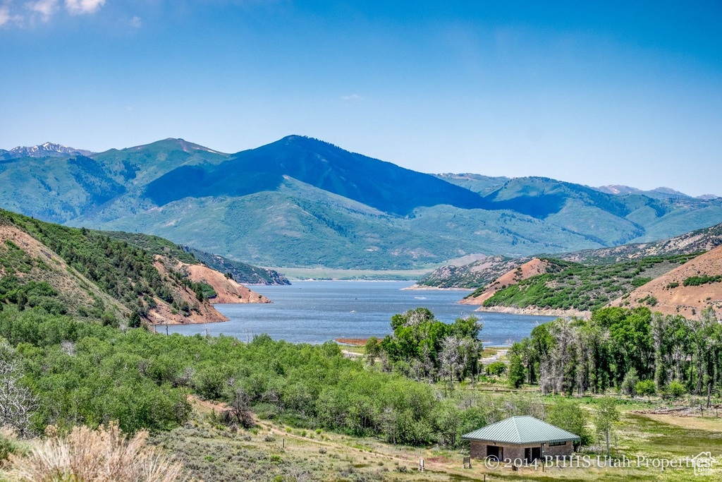 View of mountain backdrop featuring a large body of water