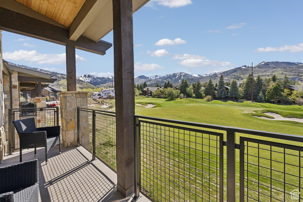 Balcony with a mountain view and golf course view