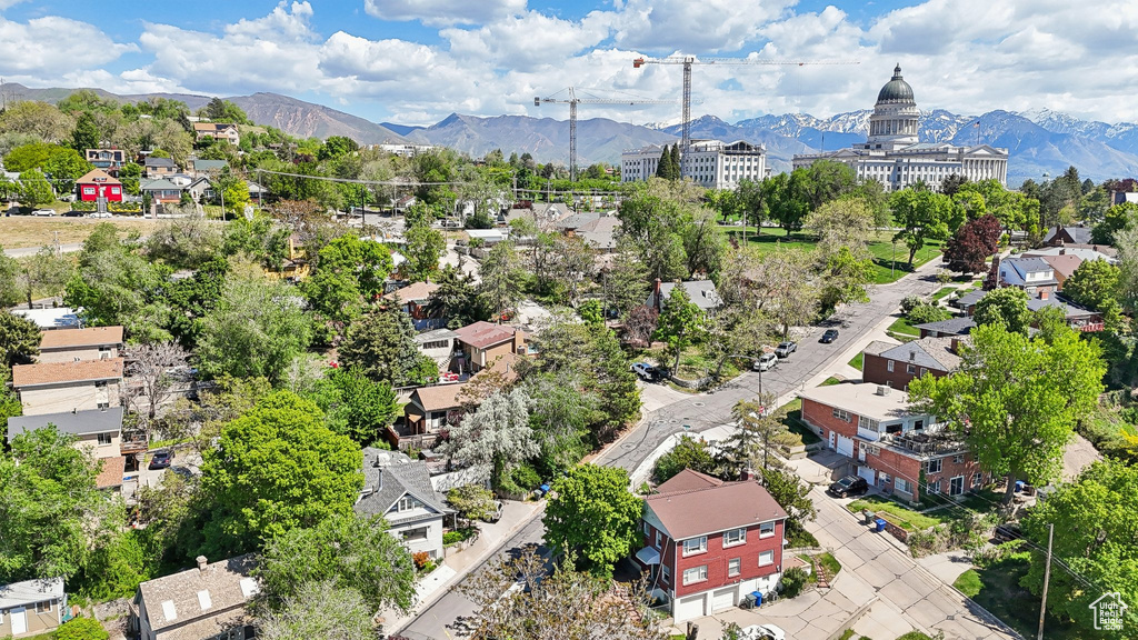 Aerial perspective of suburban area featuring a mountain backdrop