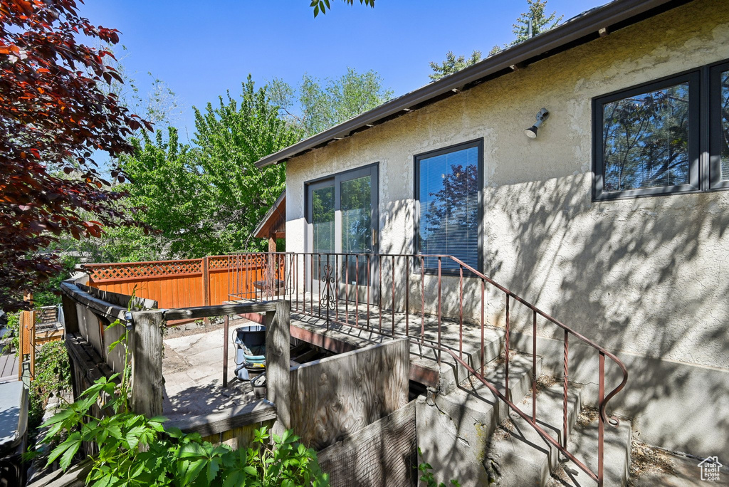 Wooden terrace featuring a patio area