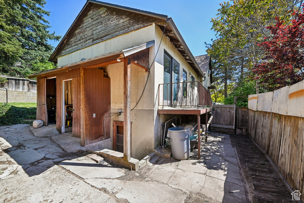 View of home's exterior with a fenced backyard and a patio
