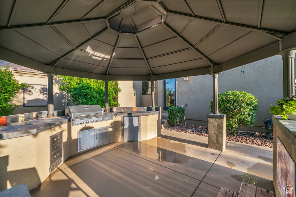 View of patio with a gazebo, an outdoor kitchen, and area for grilling