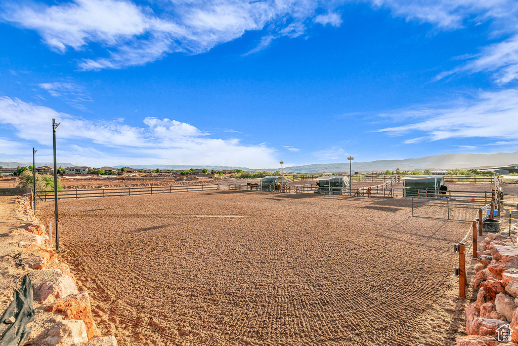View of yard with an exterior structure, a view of rural / pastoral area, a mountain view, and an outbuilding