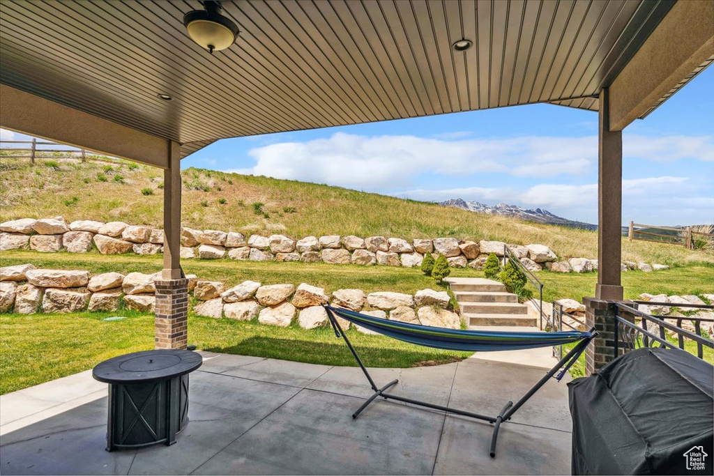 View of patio with a mountain view