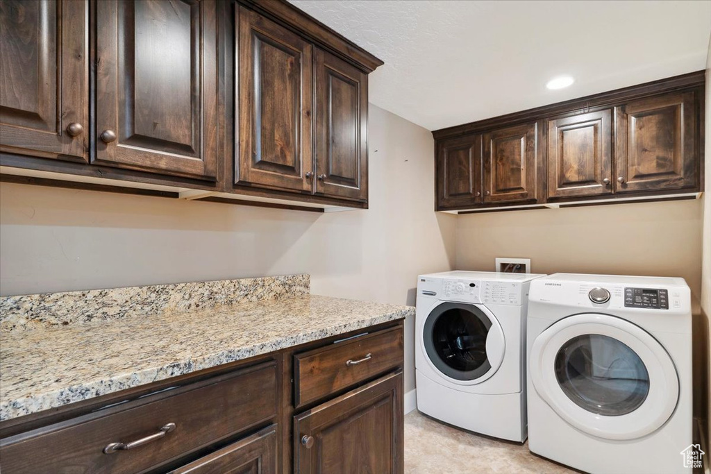 Laundry area with cabinet space and separate washer and dryer
