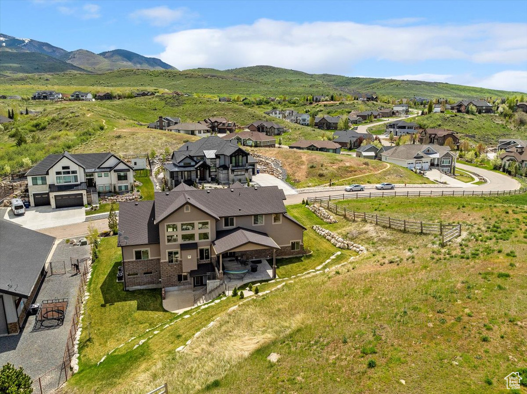Aerial perspective of suburban area with a mountainous background