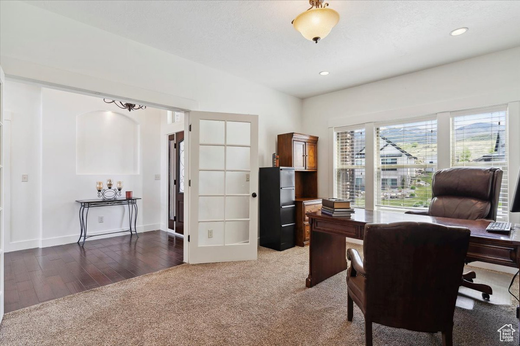 Office area featuring light colored carpet, recessed lighting, light wood finished floors, and baseboards
