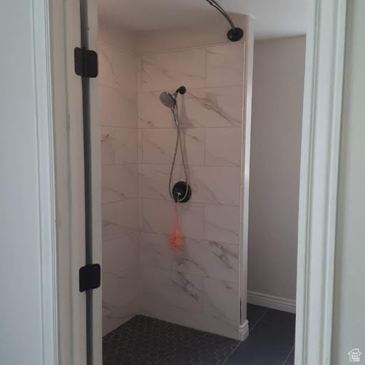 Full bathroom featuring tiled shower