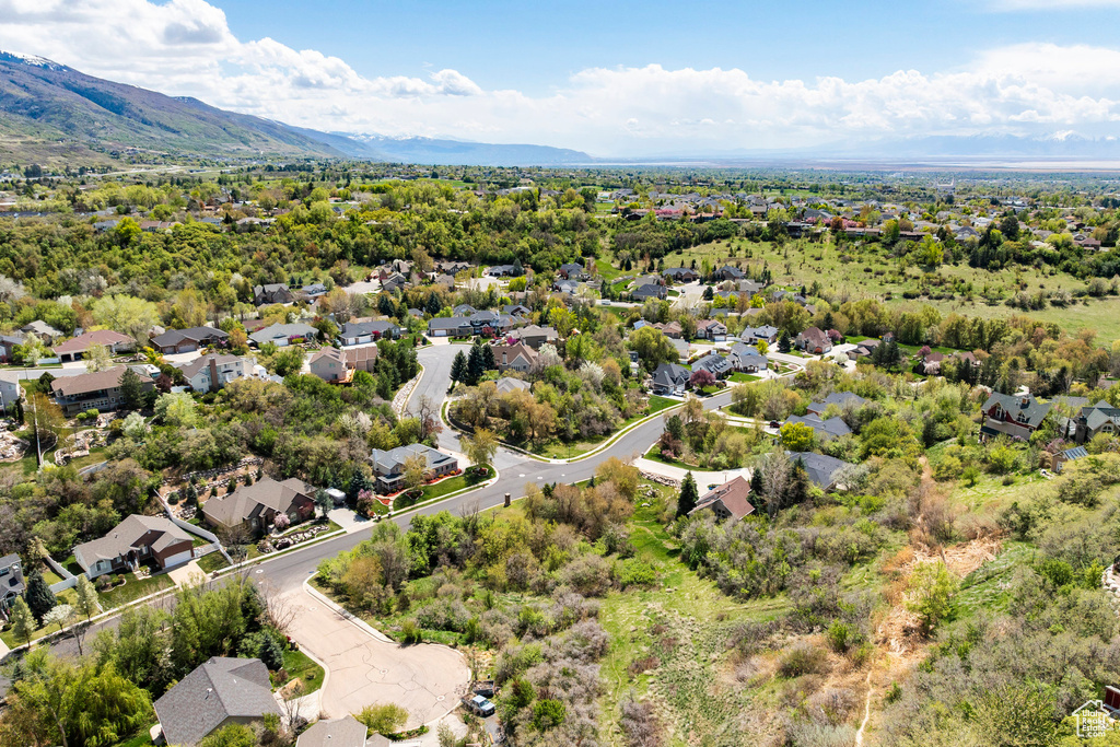 Aerial view of residential area featuring a mountain backdrop