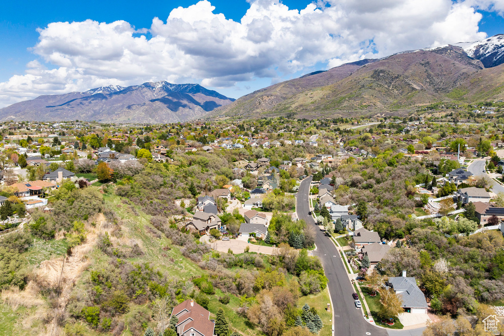 Aerial perspective of suburban area featuring a mountainous background