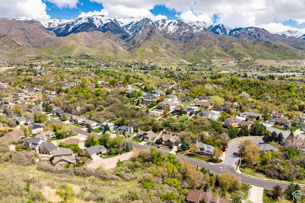 Aerial perspective of suburban area featuring a mountain backdrop