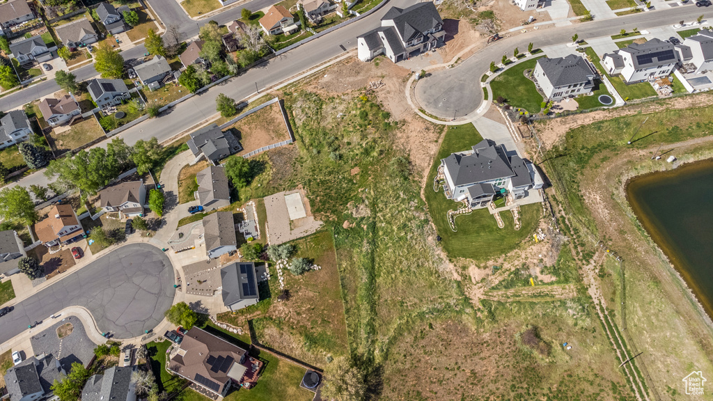 View of property location with nearby suburban area and a nearby body of water
