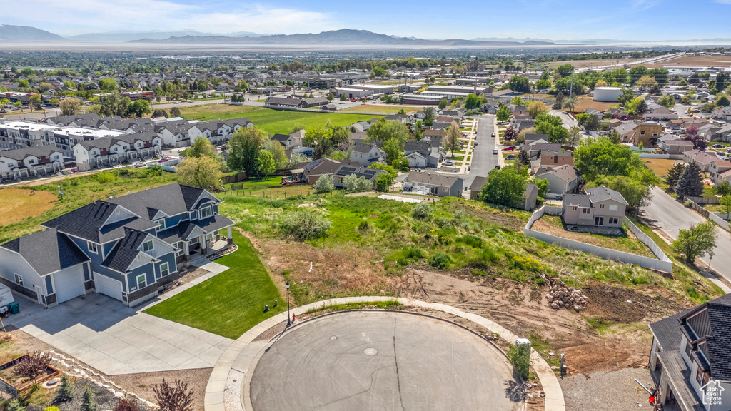 Aerial perspective of suburban area with a mountain backdrop