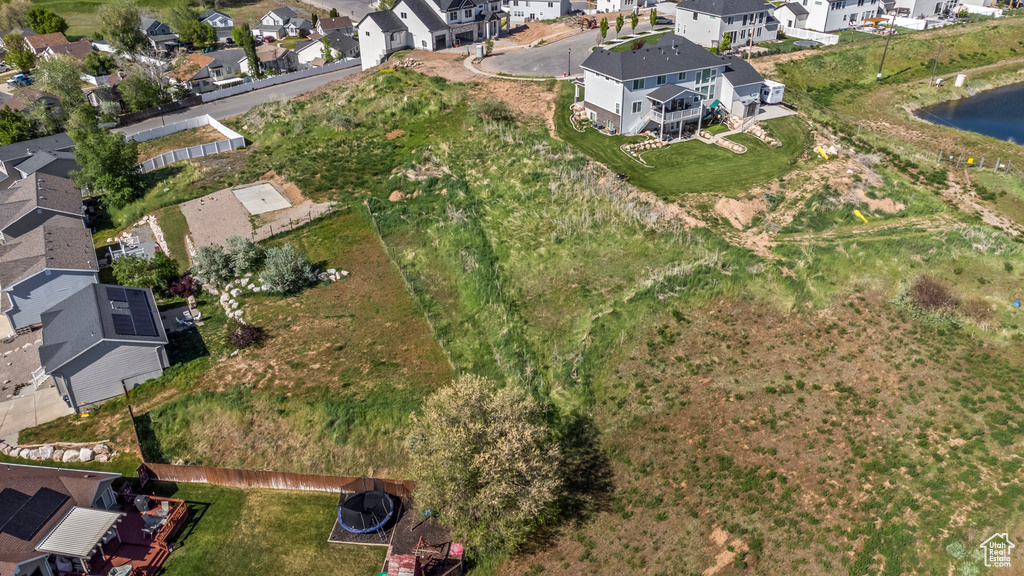 View of property location with nearby suburban area and a nearby body of water