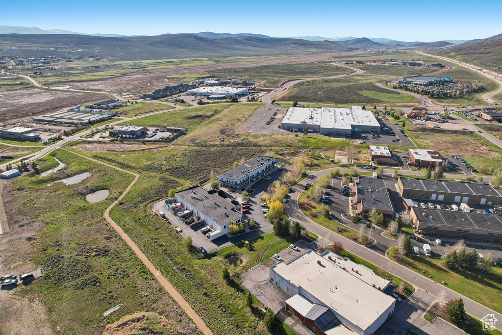 Aerial view of property and surrounding area with mountains