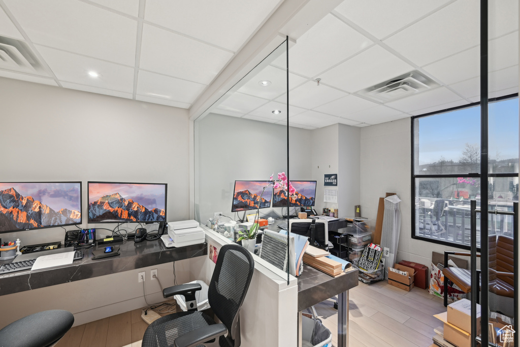 Home office featuring wood finished floors and recessed lighting