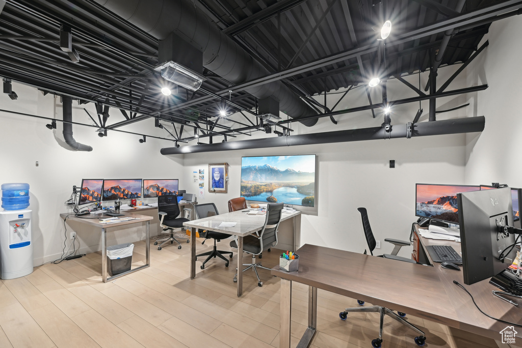 Office area with wood finished floors and baseboards