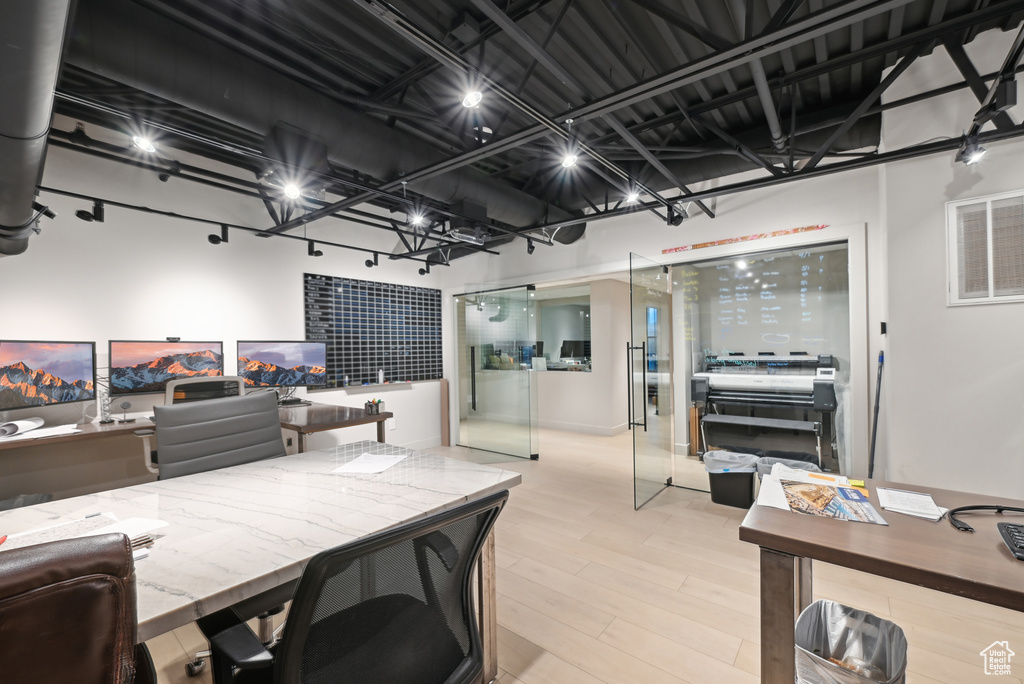 Office space with light wood finished floors