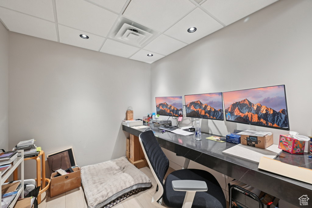 Tiled office space featuring recessed lighting and a paneled ceiling