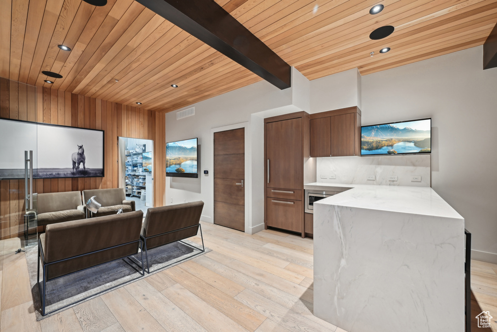 Kitchen with wood ceiling, recessed lighting, light wood-type flooring, modern cabinets, and a peninsula