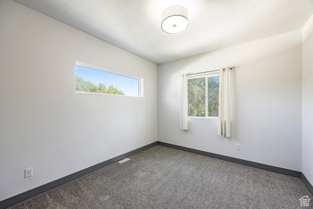 Spare room with carpet flooring and baseboards