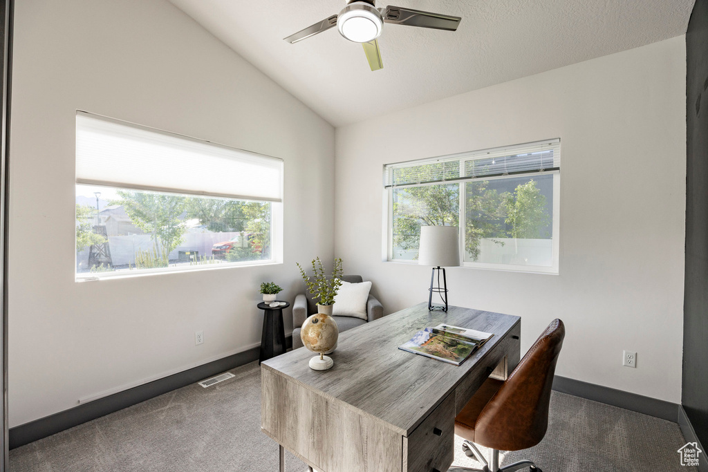Office featuring carpet floors, a ceiling fan, lofted ceiling, and baseboards