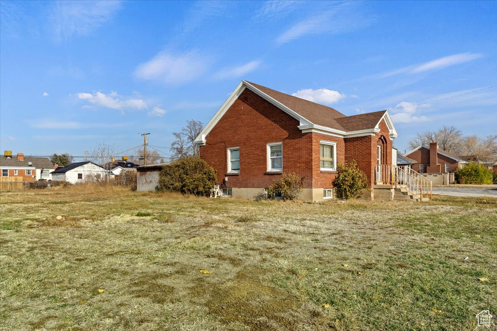 View of side of home featuring brick siding
