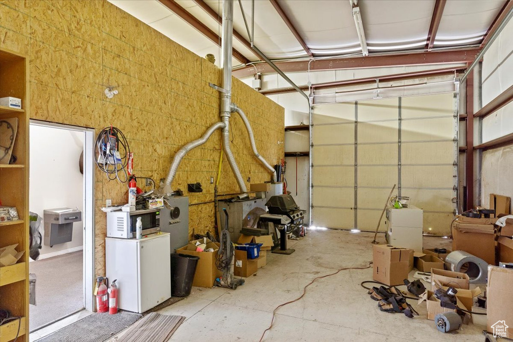 Garage featuring refrigerator