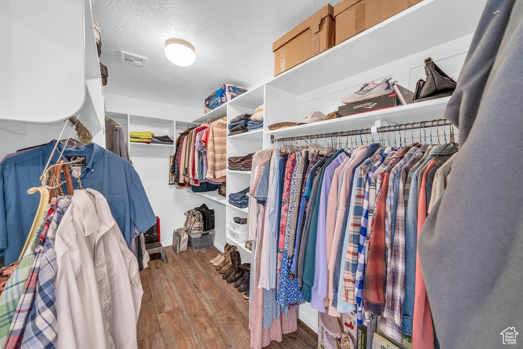Spacious closet with wood finished floors