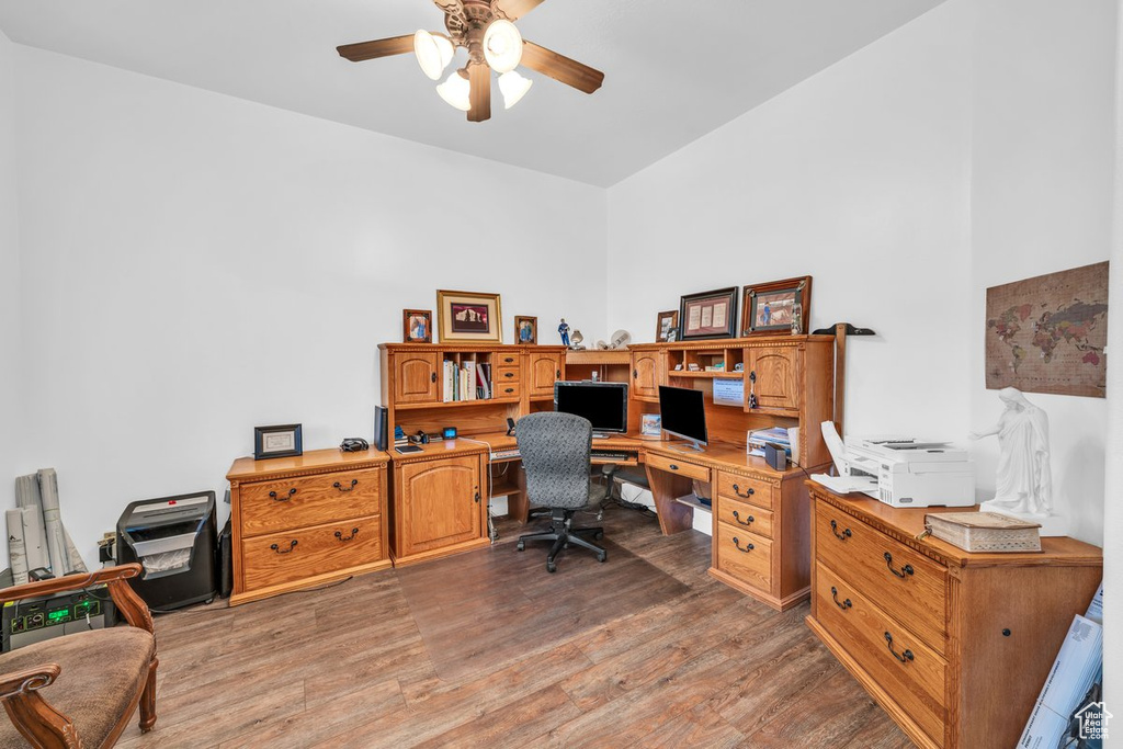 Office area featuring wood finished floors and a ceiling fan