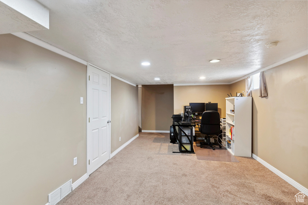 Carpeted office space featuring recessed lighting and baseboards