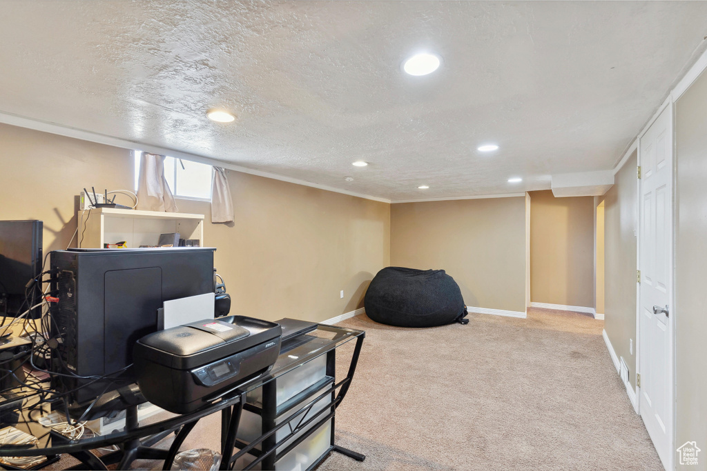 Carpeted office space featuring recessed lighting and baseboards