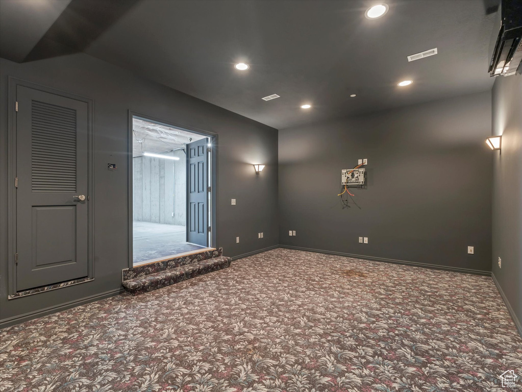 Spare room with carpet floors, recessed lighting, and baseboards