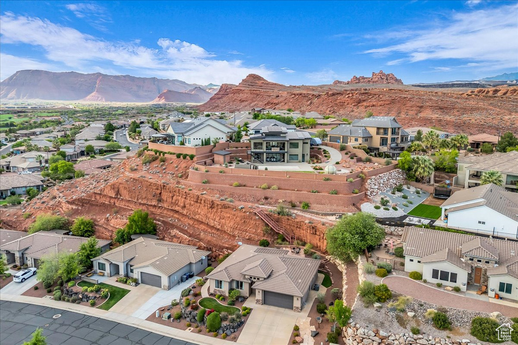 Aerial view of residential area with a mountainous background