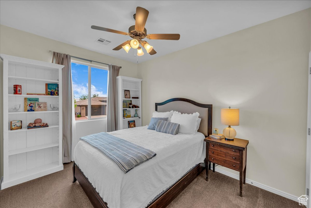 Bedroom featuring carpet, baseboards, and a ceiling fan