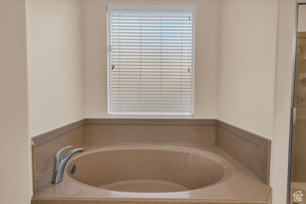 Full bathroom featuring a garden tub