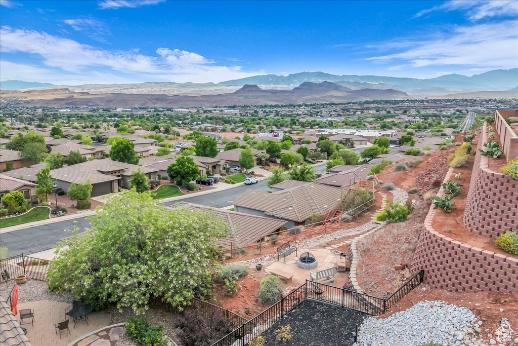 Aerial perspective of suburban area featuring a mountainous background