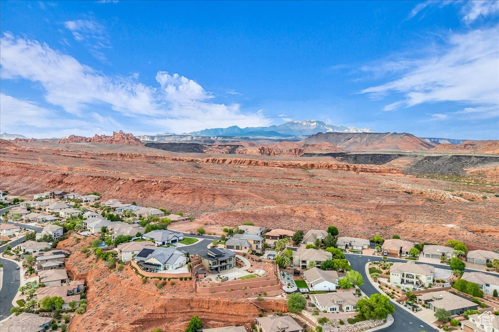 View of property location featuring nearby suburban area and a mountain backdrop