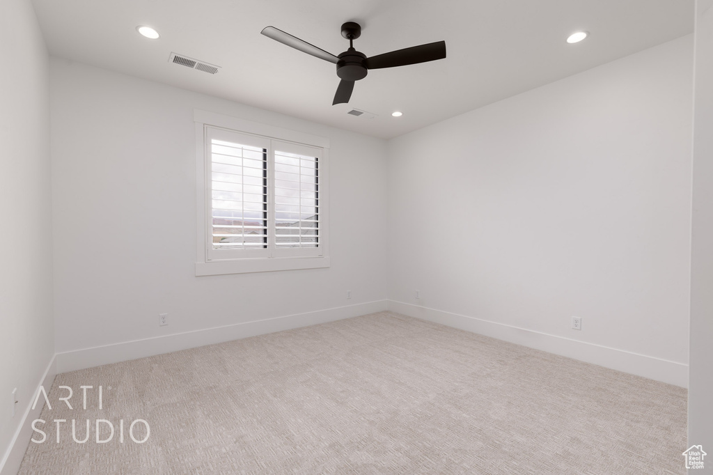 Empty room with carpet floors, ceiling fan, baseboards, and recessed lighting