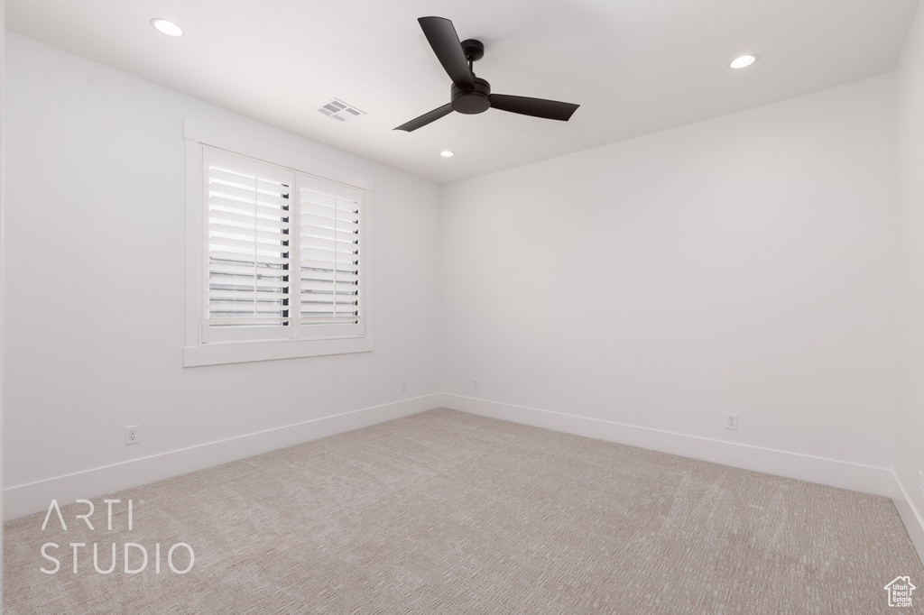 Empty room with a ceiling fan, carpet floors, recessed lighting, and baseboards
